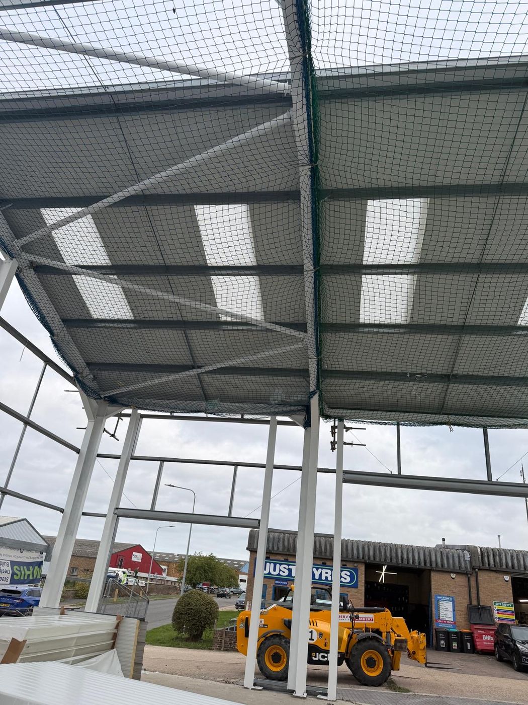 Steel framed canopy roof with liner panels viewed from below