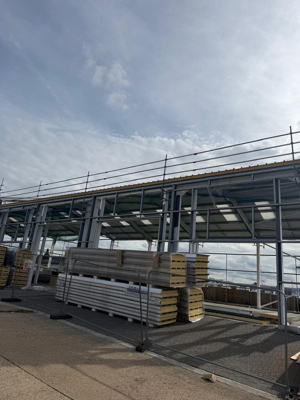 Stacked insulated cladding panels ready for installation
