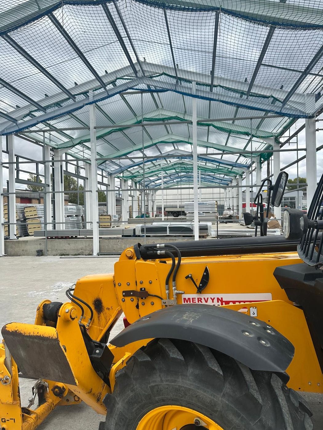 Telehandler working under the steel frame at Springwood Court
